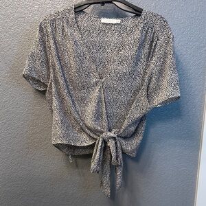 LUSH Ranya Faux Wrap Cropped Blouse with a black and white all-over print.